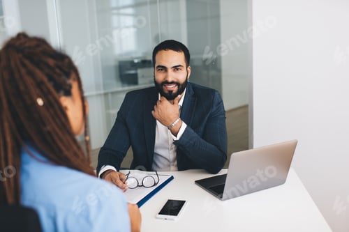Preview: Successful male and female communicating during recruitment interview in office interior