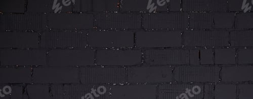Preview: Panorama of gloomy black brick wall, interior texture