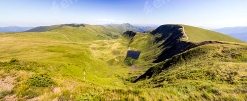Preview: Wide panorama of green mountain hills. Carpathian mountains in summer.