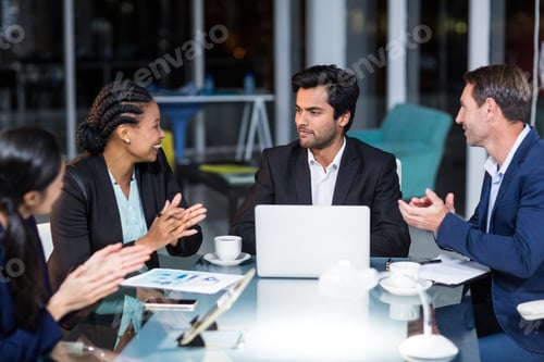 Preview: Coworkers Applauding A Colleague After Presentation In The Office