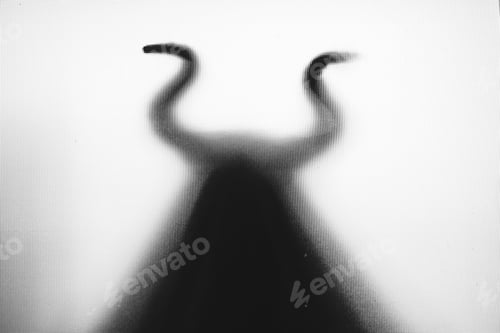 Preview: Horror, halloween background - Shadowy figure with horns behind the glass