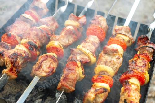 Preview: Grilled fried pork meat, pieces of meat on skewers.