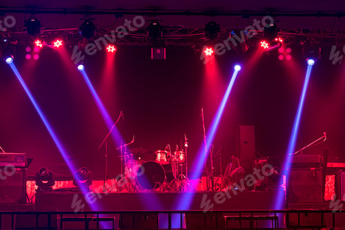 Preview: Musical instruments with spotlight on the stage with light ray in conference hall