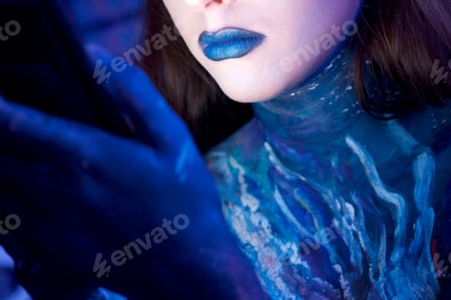 Preview: Futuristic young woman body paint, blue lips painted skin
