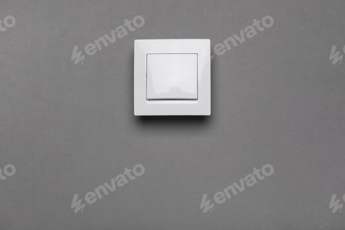 Preview: White light switch on grey background. Space for text