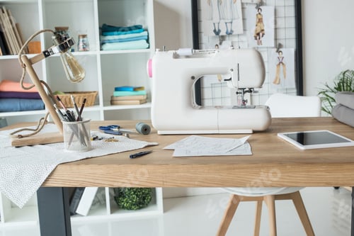 Preview: seamstress workplace with sewing machine on table