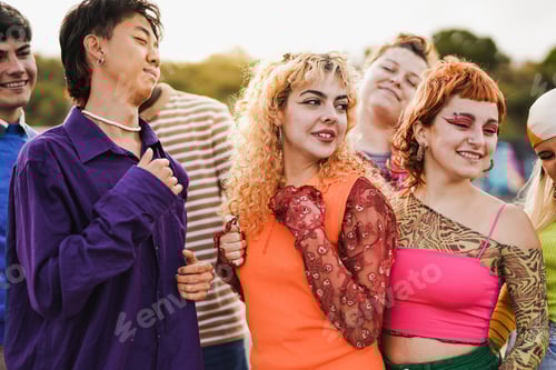 Preview: Group of happy multiethnic people dancing together at summer concert outdoor