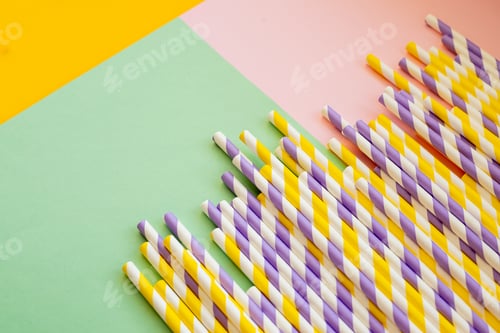 Preview: Drinking paper colorful straws for summer cocktails on light pastel background with copy space. Eco