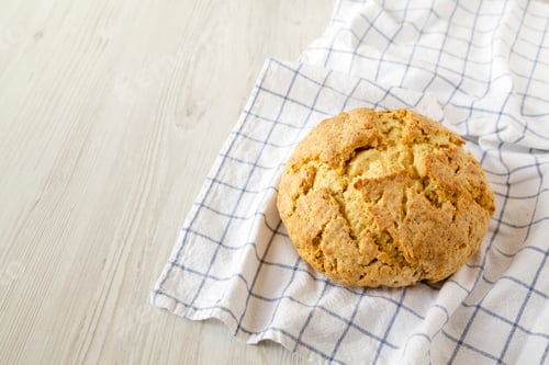 Preview: Homemade Irish Soda Bread on a white wooden background, side view. Copy space.