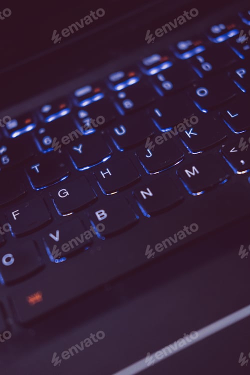 Preview: close up of backlit keyboard computer programming or software development concept