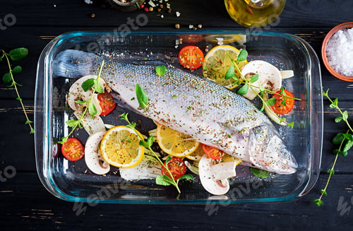 Preview: Raw fish. Sea bass on baking dish. Ingredients for cooking, grill, baked. Copy space. Top view