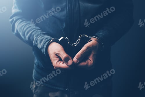 Preview: Arrested computer hacker with handcuffs