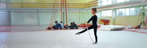 Preview: Young Gymnast in Training Wide Banner with Copy Space