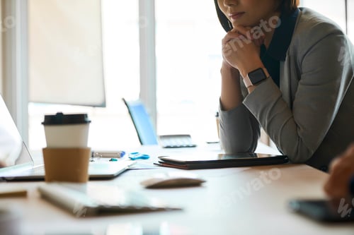 Preview: Pensive elegant businesswoman