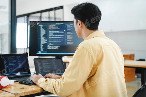 Preview: IT Programmer Starts Working on Desktop Computer.