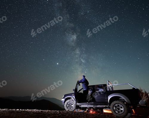 Preview: Night camping in the mountains under starry sky.