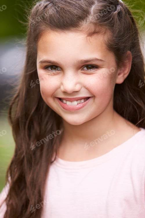 Preview: Portrait Of Smiling Young Girl Standing Outdoors In Garden