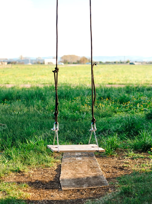 Preview: empty Children swing in the park