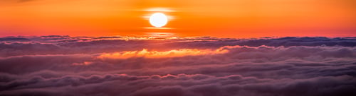 Preview: Panoramic view of a fiery sunset over a sea of clouds covering San Francisco bay area, California