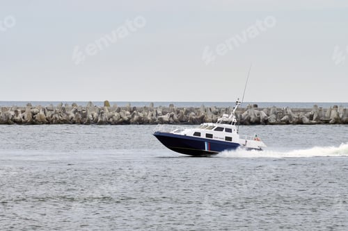 Preview: Coast guard boat sails along seaside for safeguarding coastal boundaries and maritime interests