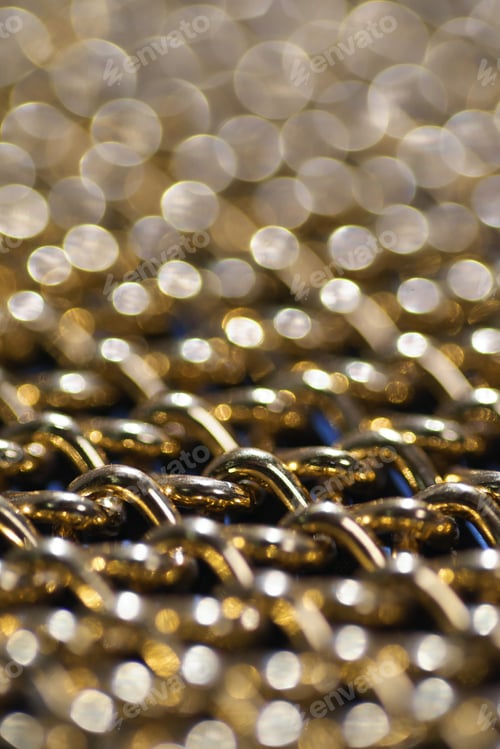 Preview: Background of the golden chain with light bokeh