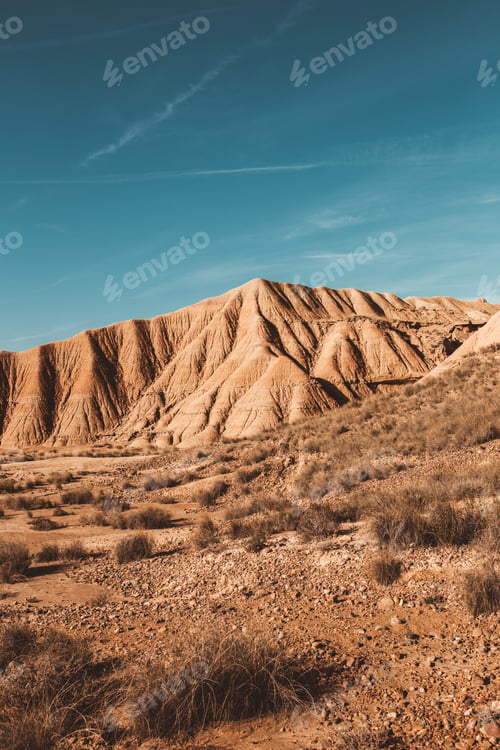 Preview: Desert cliffs under blue sky in landscape