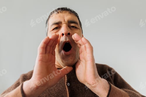 Preview: shocked elderly man put hands on face and very surprised male puts his hands to his ope