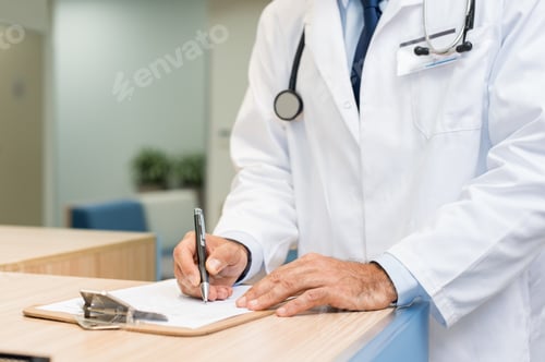 Preview: Doctor examining medical report