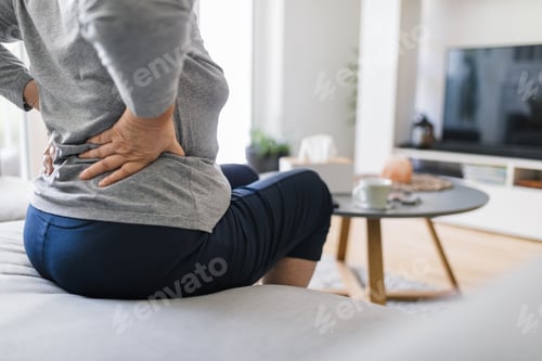 Preview: Elderly woman at home with back pain