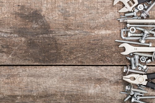 Preview: Tools organized on a wooden surface preparing for a DIY project or repair task