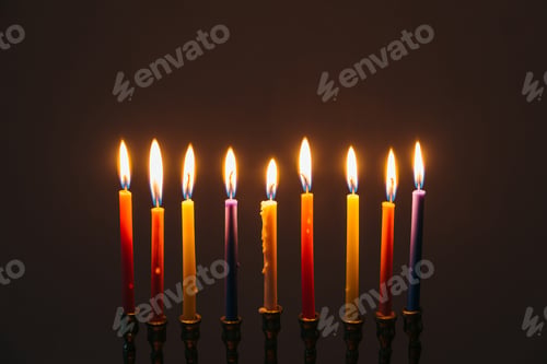 Preview: Jewish Holiday Hanukkah background with candles, traditional candelabra menorah on dark background