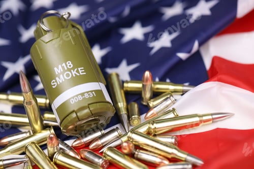 Preview: M18 smoke grenade and many yellow bullets and cartridges on United States flag