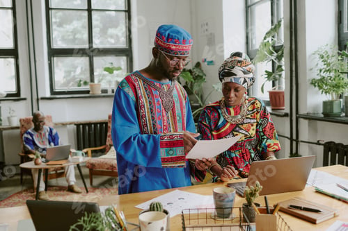 Preview: Colleagues Communicating in Office