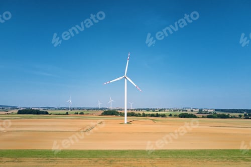 Preview: Windmill turbine in the field at summer day. Rotating wind generator