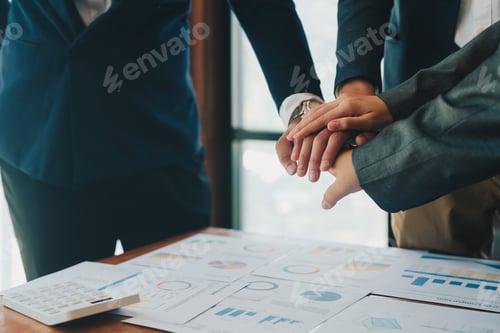 Preview: hands of multiethnic business team touching in circle for sign of teamwork trust and collaboration
