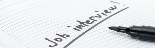 Preview: panoramic shot of job interview lettering on white paper near black marker