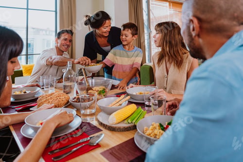 Preview: Family and friends reunion at home. Happy multigenerational family enjoying meal together at home