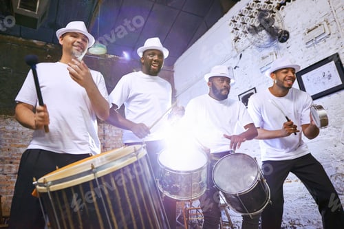 Preview: Theyve got the beat that you need. Shot of an ethnic group performing indoors.
