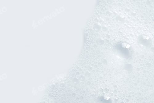 Preview: White facial skin care foam creamy bubble soap sponge on white background with copy space