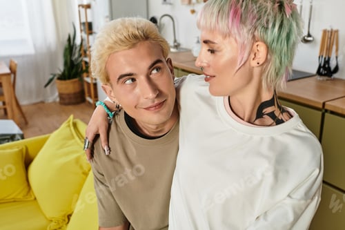 Preview: Young couple sharing a tender moment together in a cozy, modern living space filled with love