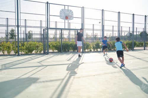 Preview: Three brothers play football, one has a prosthesis, other is kicking a penalty.