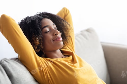 Preview: Portrait Of Calm Young Black Woman Resting On Comfortable Sofa At Home