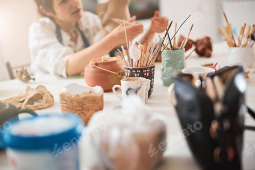 Preview: Table covered with pottery instruments and appliances