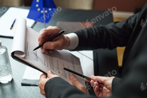 Preview: Middle Aged Caucasian Men Discussing Document during Political Negotiation