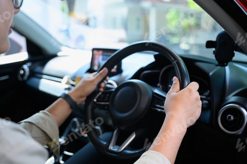 Preview: Closeup man driving a car
