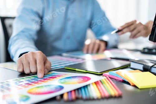 Preview: Team of creative graphic designer working on color swatch samples chart for selection coloring