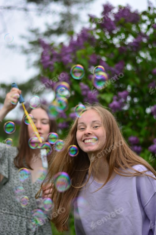 Preview: Girls blowing bubbles