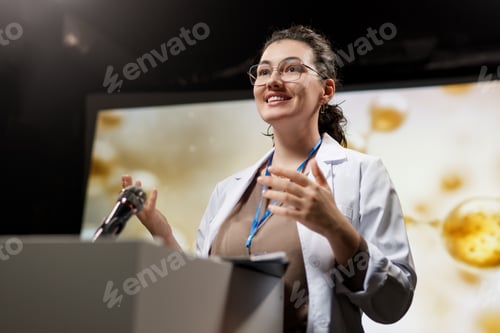 Preview: woman is giving a presentation at a conference