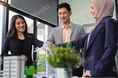 Preview: Businessmen shake hands after agreeing to start a new project successfully