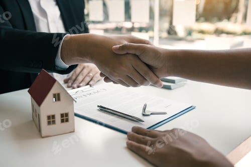 Preview: Home sales agents and buyers work on signing new homes and shaking hands.